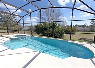 Florida screened-in pool with intact cage and minimal debris