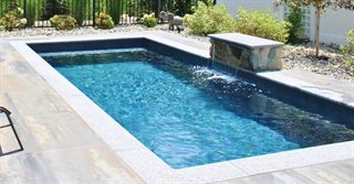Open Florida pool with few surrounding trees