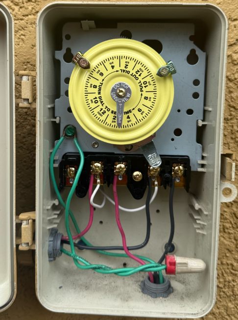 Same electrical box rewired with a new timer and clean labeled connections