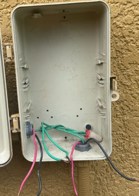 Pool electrical box with tangled wiring before service
