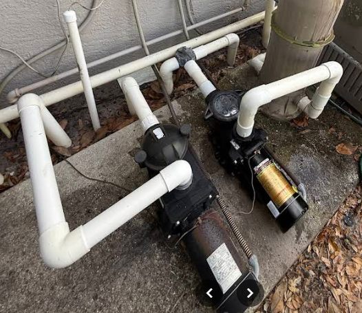 New variable-speed pool pump installed on a Sarasota equipment pad with fresh PVC plumbing by Sundays Pools