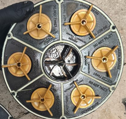 Multiport valve discs with corrosion and buildup before refurbishment